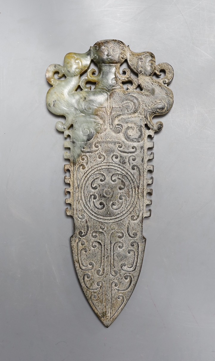 A 20th century Chinese archaistic jade carving, model of an axe head, 30.5 cms long.